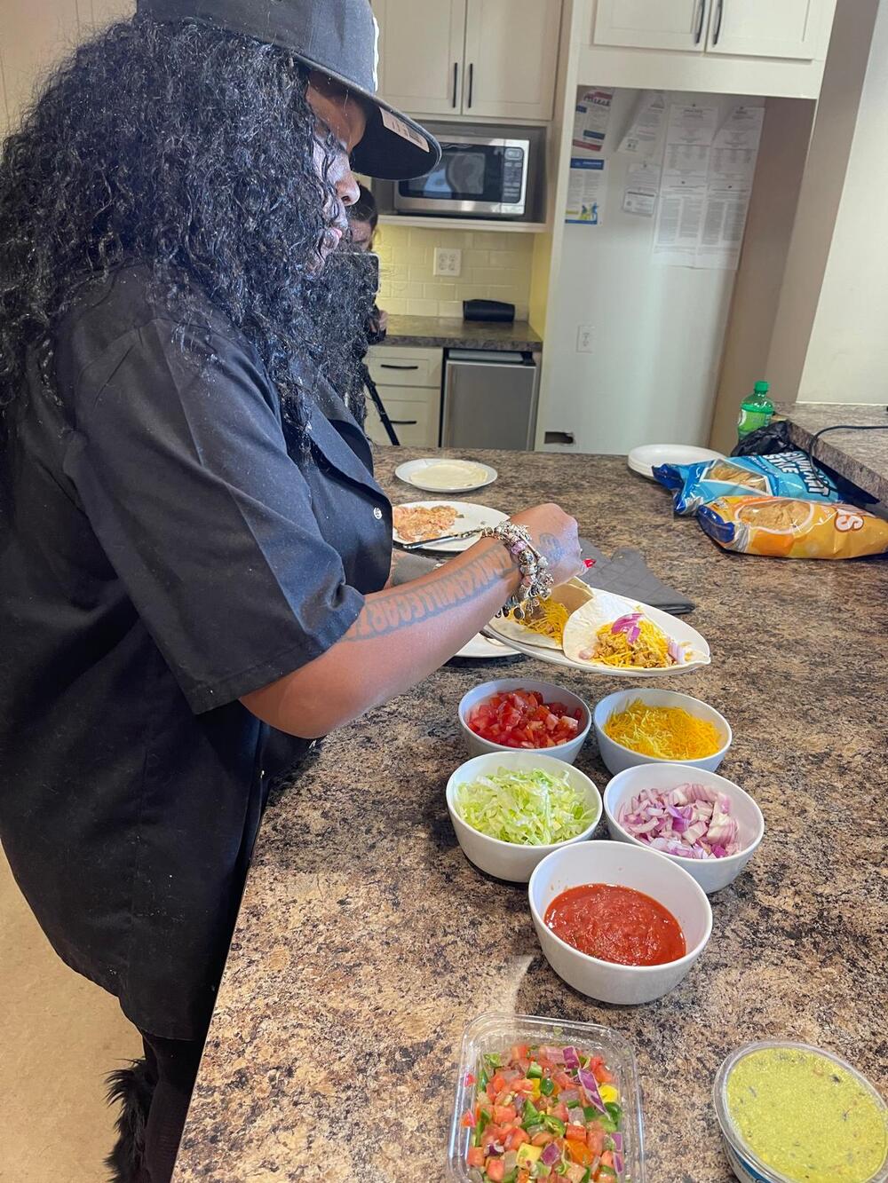 Chef Kamille prepping fresh ingredients in the kitchen