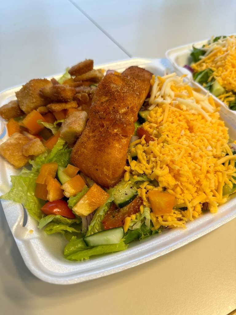 Salmon over fresh garden salad